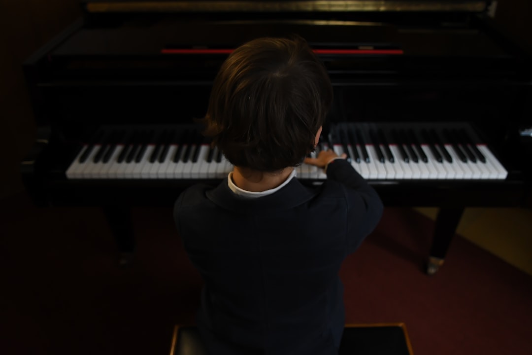 Young student practicing piano with proper posture