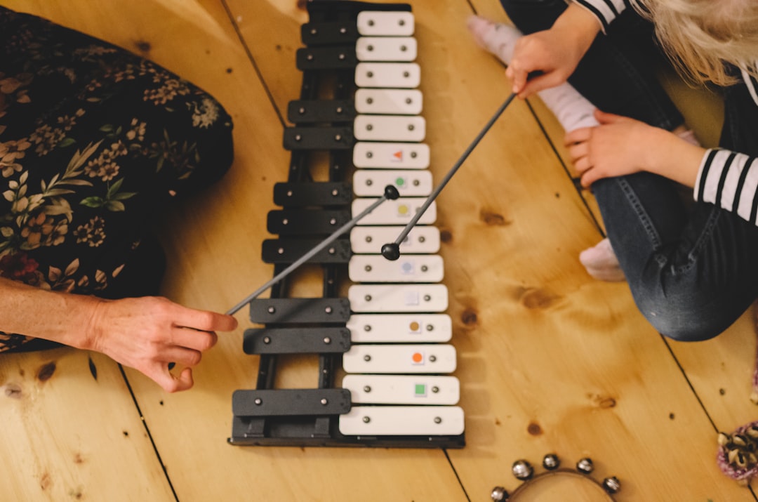 Children playing musical instruments at Tune Town Music Academy